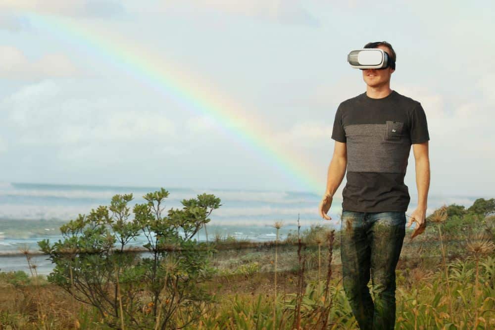 Perception of Reality - guy walking through a field wearing AR goggles